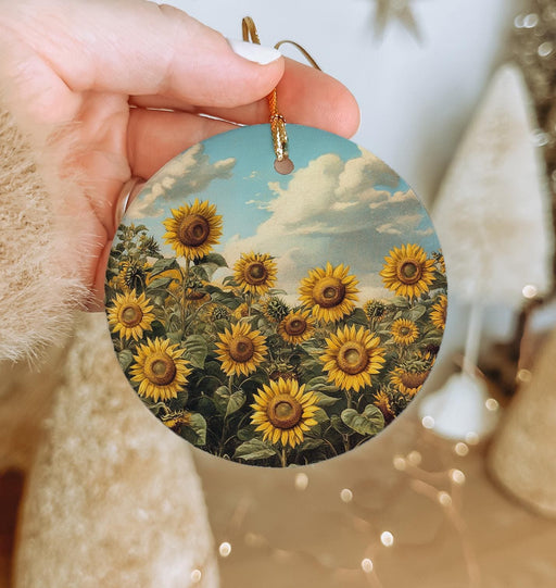 a person holding a sunflower ornament in their hand