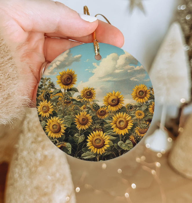 a person holding a sunflower ornament in their hand