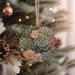 a christmas ornament hanging from a christmas tree