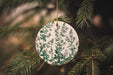 a ceramic ornament hanging from a christmas tree