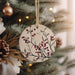 a ceramic ornament hanging from a christmas tree