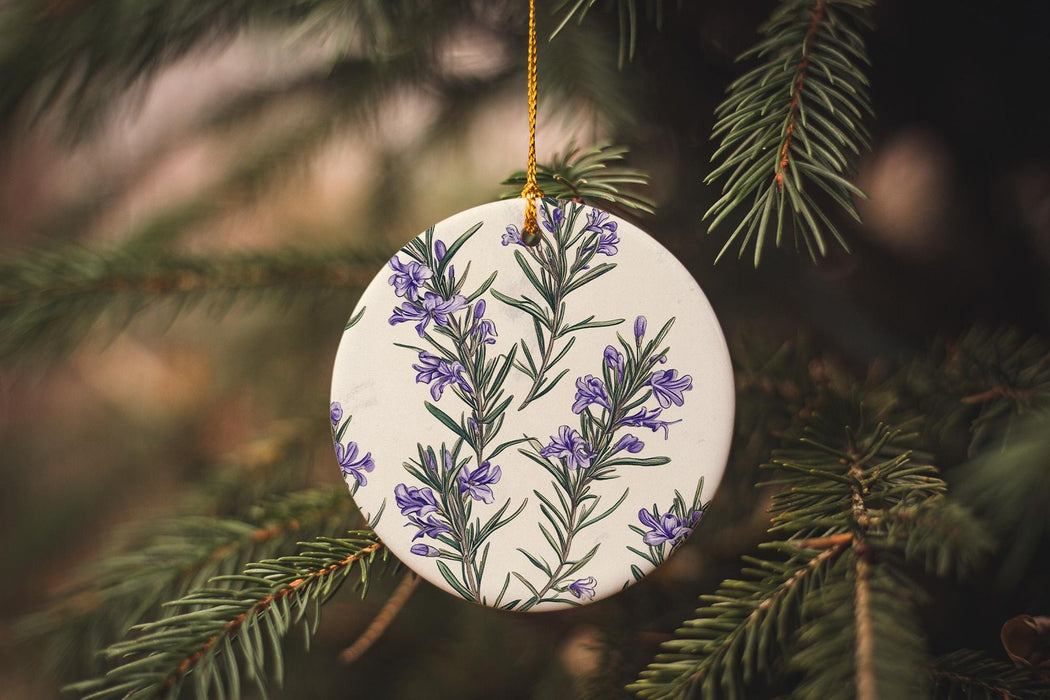a ceramic ornament hanging from a christmas tree