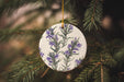 a ceramic ornament hanging from a christmas tree