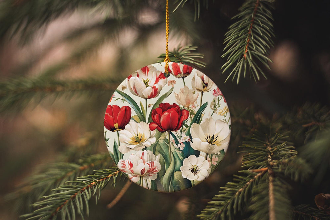 a christmas ornament hanging from a pine tree