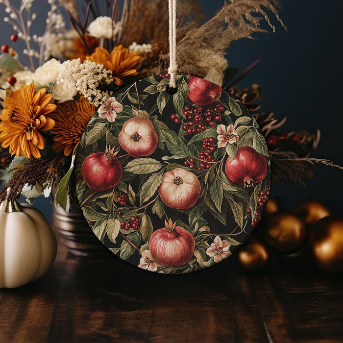 a table topped with a vase filled with flowers and fruit