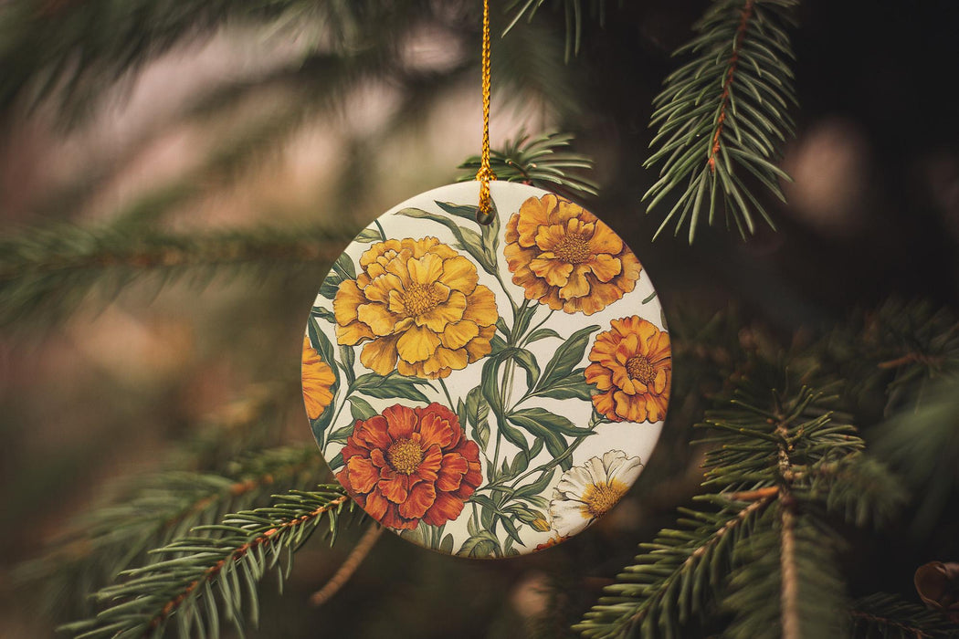 a ceramic ornament hanging from a pine tree