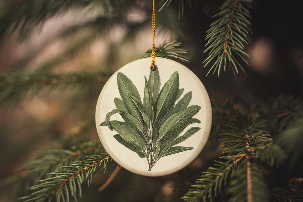 a ceramic ornament with a green leaf on it