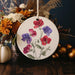 a white plate with flowers painted on it