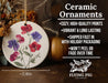 a ceramic ornament with flowers painted on it