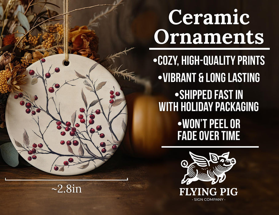 a ceramic ornament with red berries on it