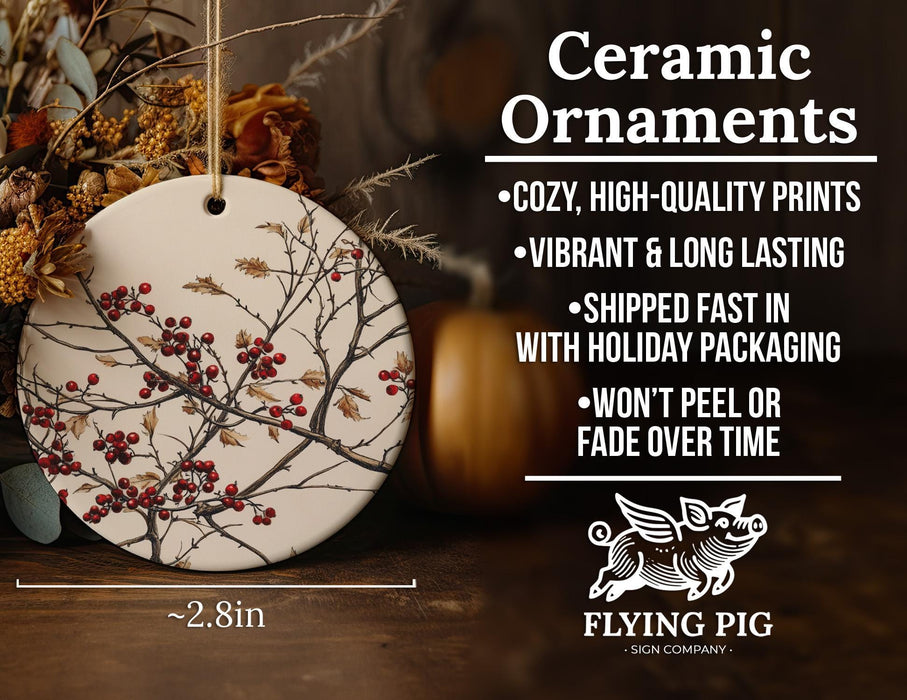 a ceramic ornament with red berries on it