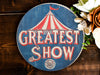 a sign that says the greatest show on it