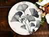 a plate with flowers on it sitting on a table