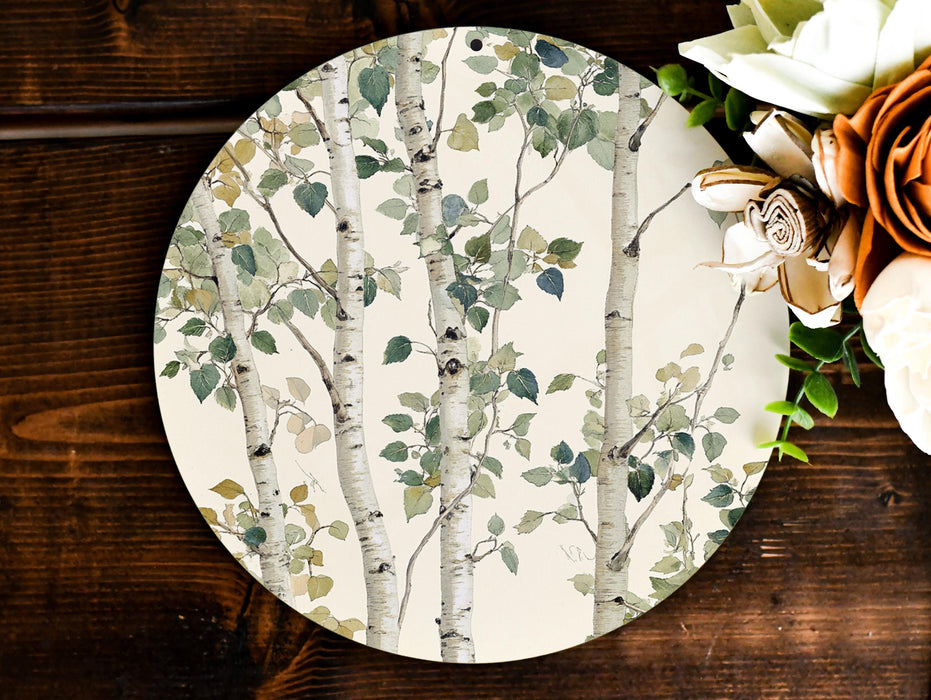 a white plate with a tree design on it