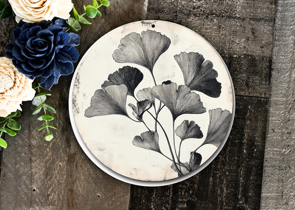 a black and white plate with flowers on it
