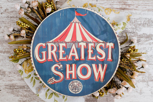 a sign that says greatest show on it