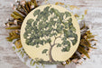 a plate with a tree painted on it