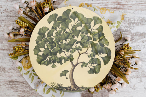 a plate with a tree painted on it