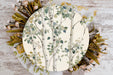 a paper plate with a tree design on it