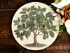 a plate with a picture of a tree on it