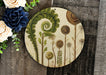 a picture of some flowers on a wooden board