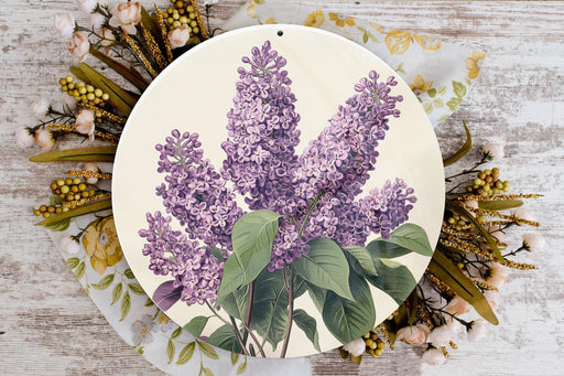 a plate with a painting of purple flowers on it