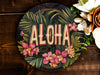 a picture of a flower arrangement with the word aloha painted on it