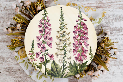 a plate with flowers painted on it on a table