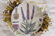 a paper plate with flowers and a flask on it