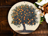a picture of an orange tree on a plate