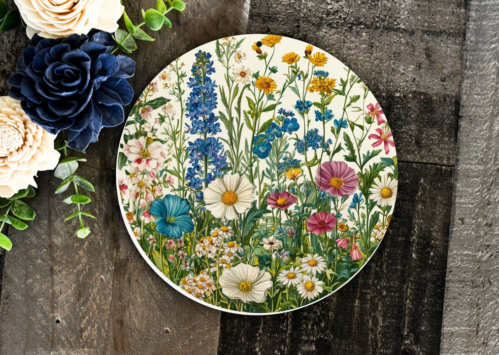a plate with flowers on it next to a bouquet of flowers
