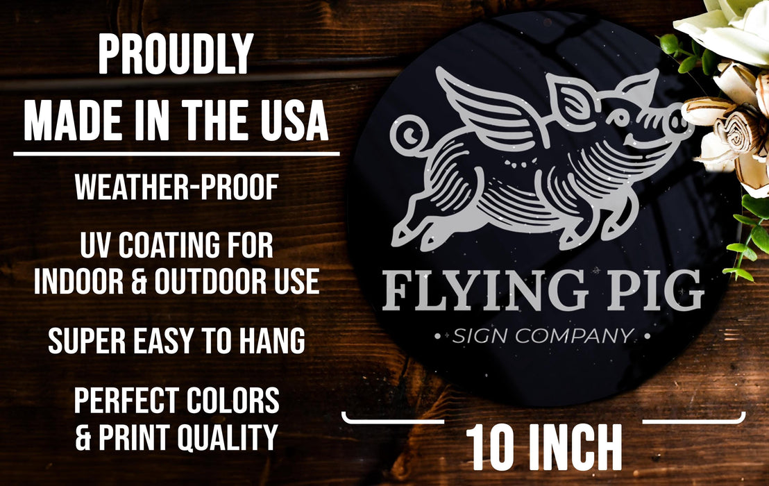 a flying pig sign on a wooden table