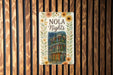 a wooden wall with a sign that says nola nights