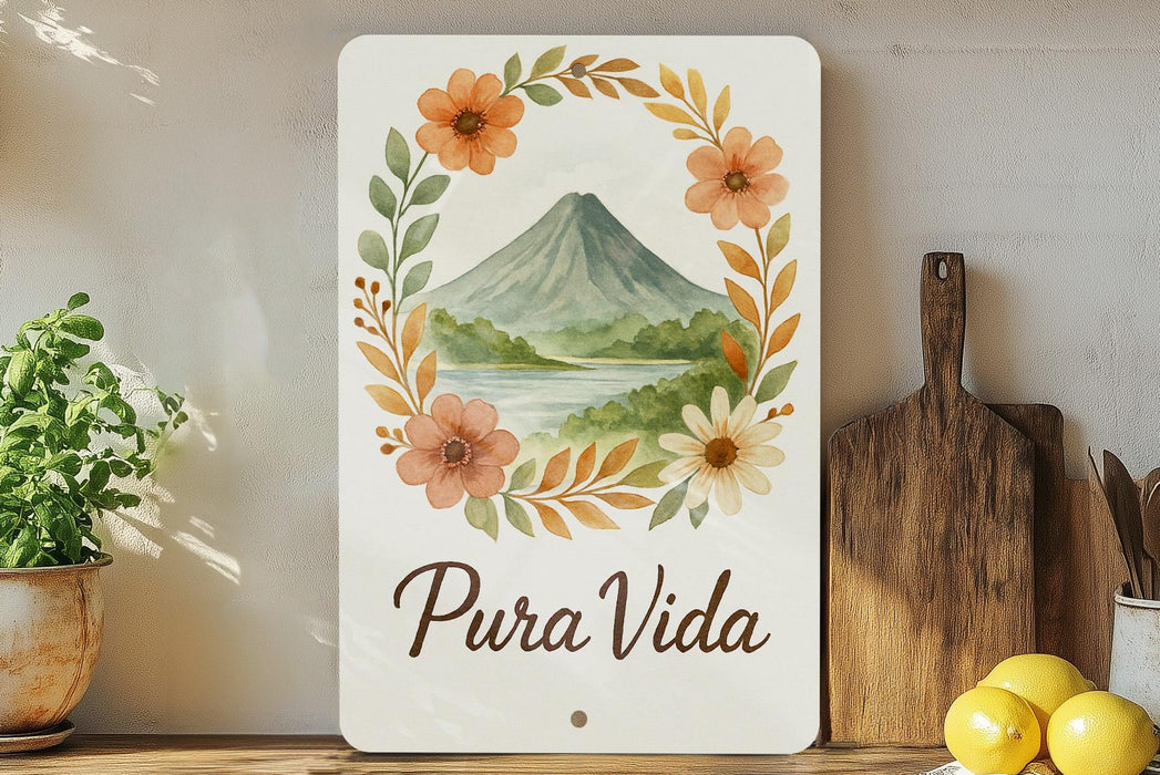 a sign that says pura vida with a picture of a volcano in the