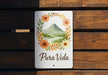 a wooden bench with a sign that says pura vida
