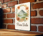 a sign that says pura vida on a brick wall