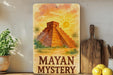 a painting of a pyramid on a shelf