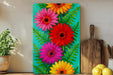 a painting of colorful flowers on a green background