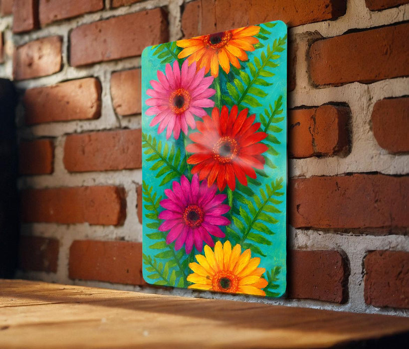 a painting of colorful flowers on a brick wall