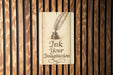a sign on a wooden wall that says ink your imagination