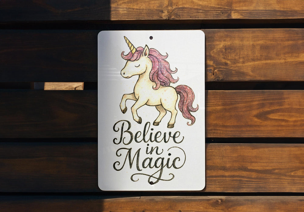 a sign that says believe magic with a unicorn on it