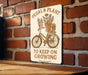 a sign on a brick wall that says pedal and plant to keep on growing