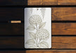 a picture of some flowers on a wooden bench