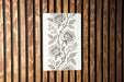 a piece of paper with a drawing of flowers on it