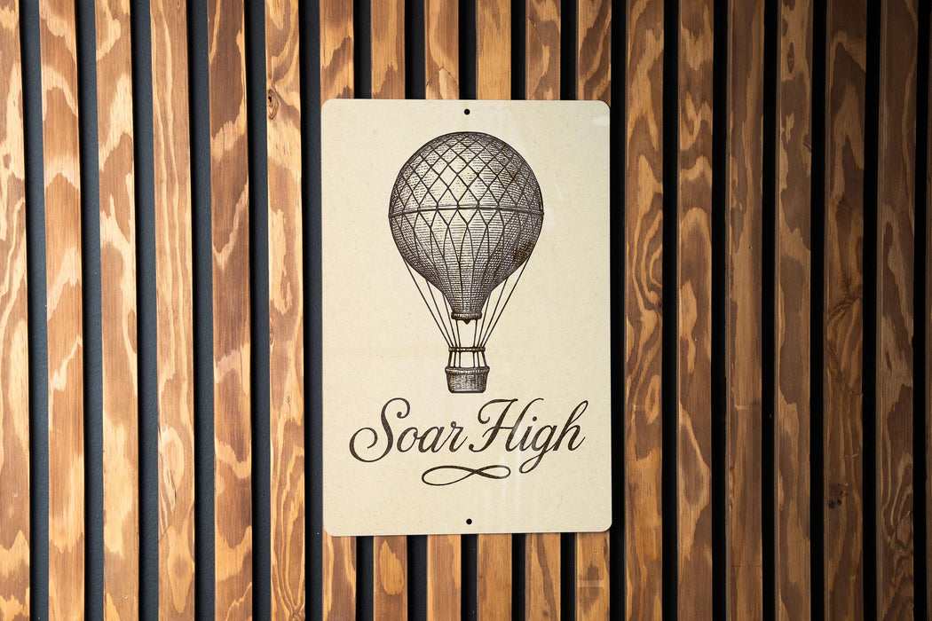 a sign on a wooden wall that says soar high