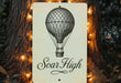 a sign that says soar high with a hot air balloon