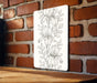 a drawing of a flower on a white board