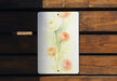 a picture of some flowers on a wooden bench