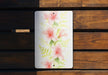 a painting of pink flowers on a wooden bench