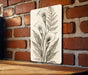 a picture of a flower on a brick wall